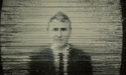 Ken Griffin on a blurred TV 