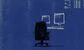 an empty blue chair on a trading floor 